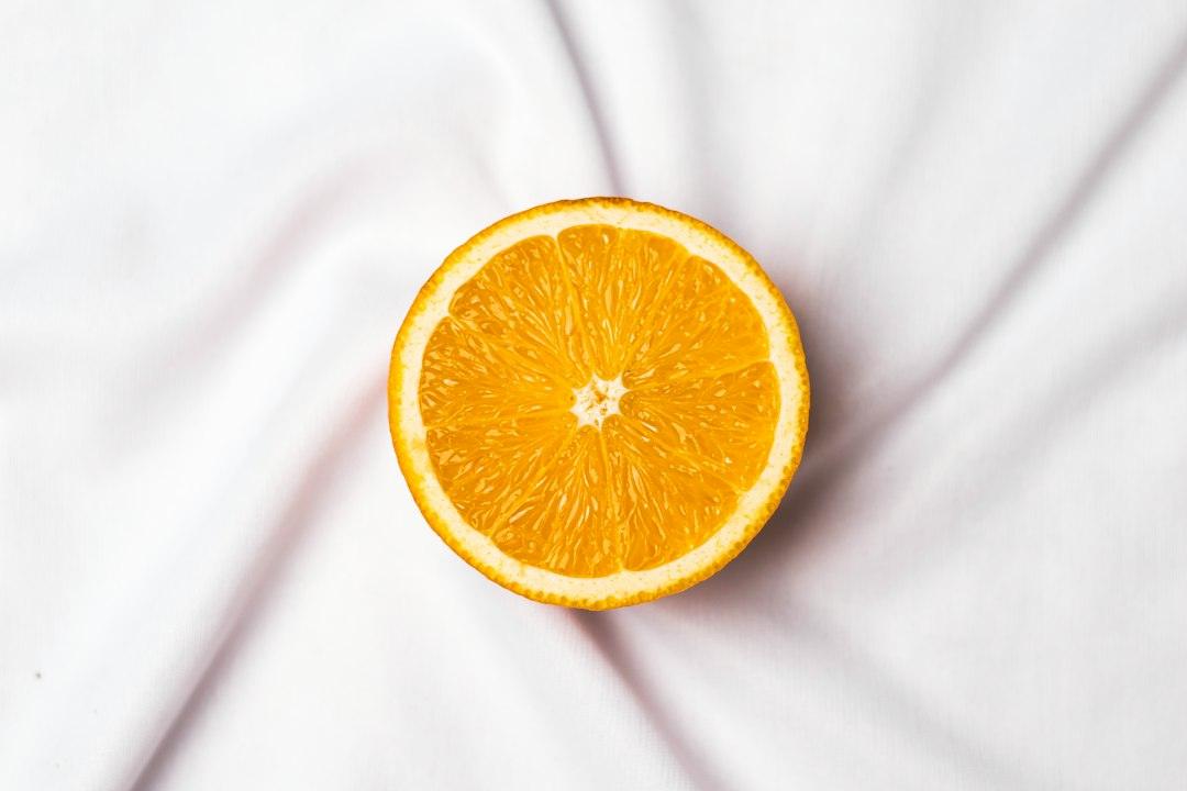 Editorial vitamin C and citrus image for comparing ascorbic acid with vitamin C complexes in cosmetic formulation