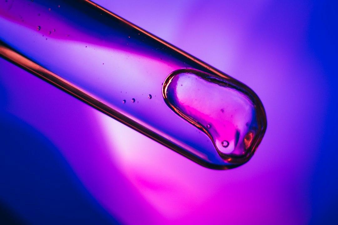 Blue cosmetic liquid texture illustrating GHK-Cu and peptide formulation comparison