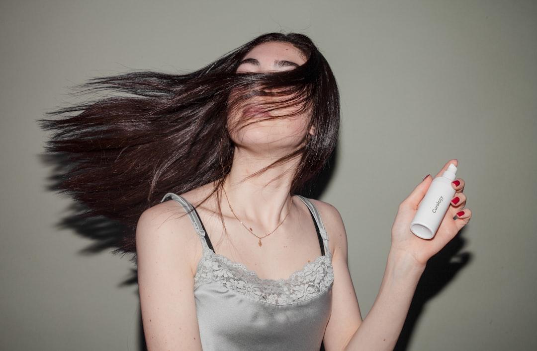 Premium editorial haircare scene illustrating heat-activated hair repair and skincare-inspired cosmetic formulation