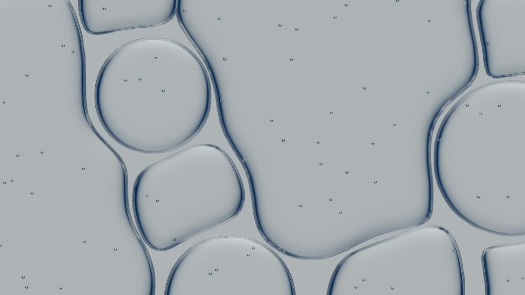 Abstract serum texture and bubbles representing cosmetic viscosity troubleshooting