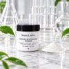 BLP Glutathione Peptide Powder, white jar with powder sample in a glass dish